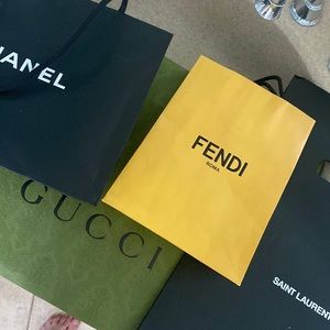 Chanel, Fendi, YSL and Gucci shopping bags